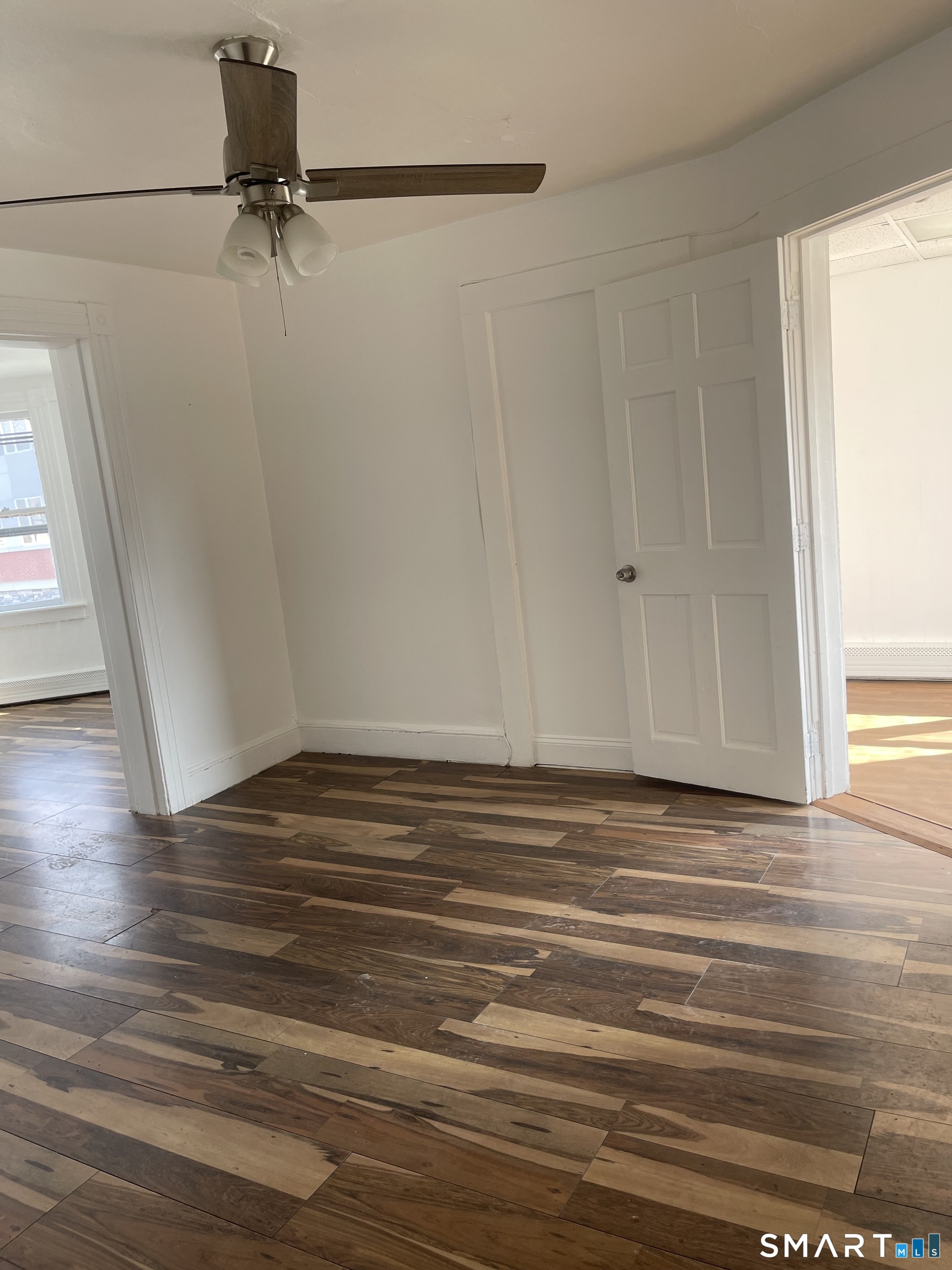 85 Franklin Street Torrington, CT 06790 - Photo 12 of 21 a view of a room with wooden floor and brick walls