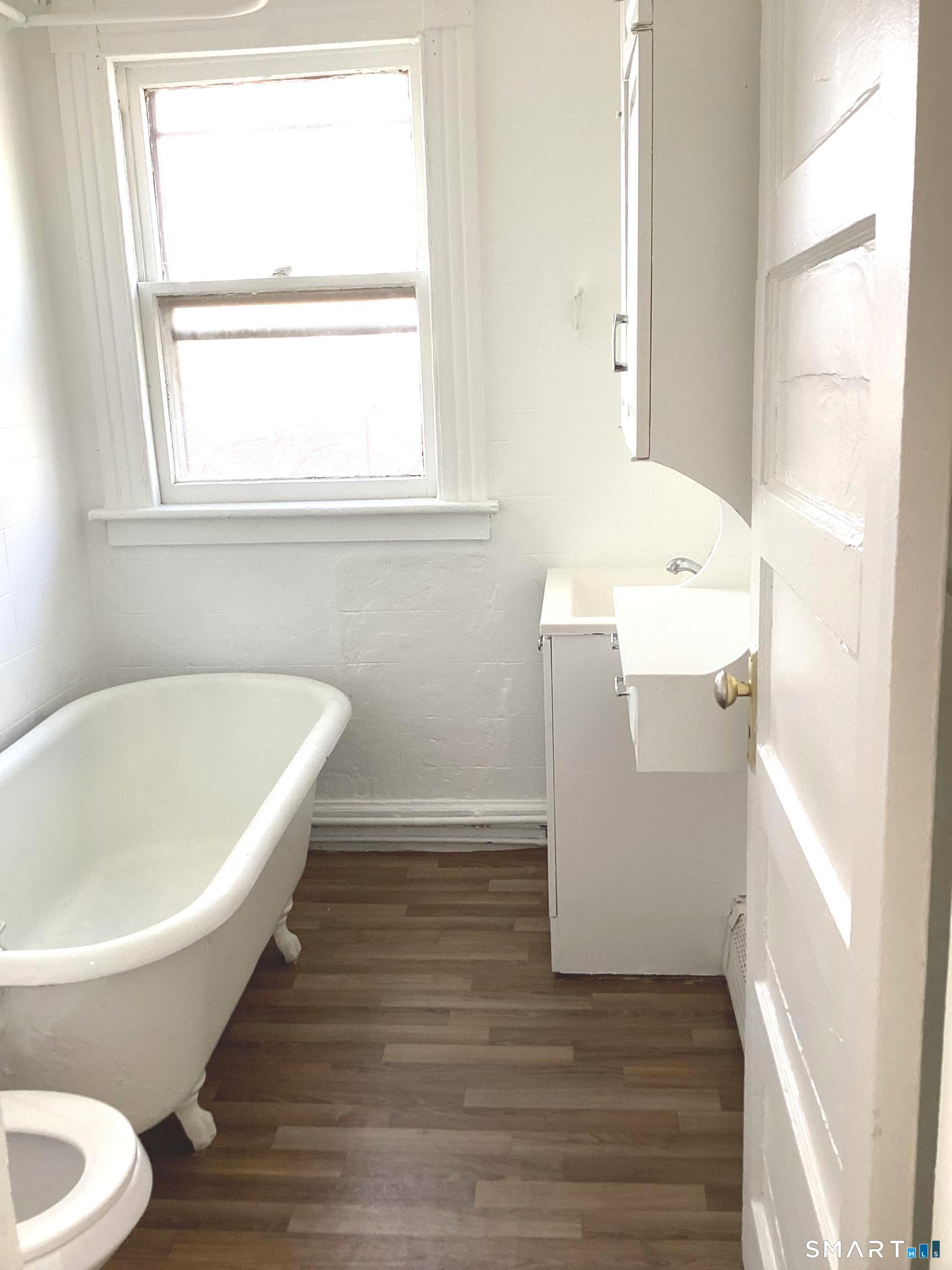 85 Franklin Street Torrington, CT 06790 - Photo 7 of 21 a bathroom with a sink and a bathtub
