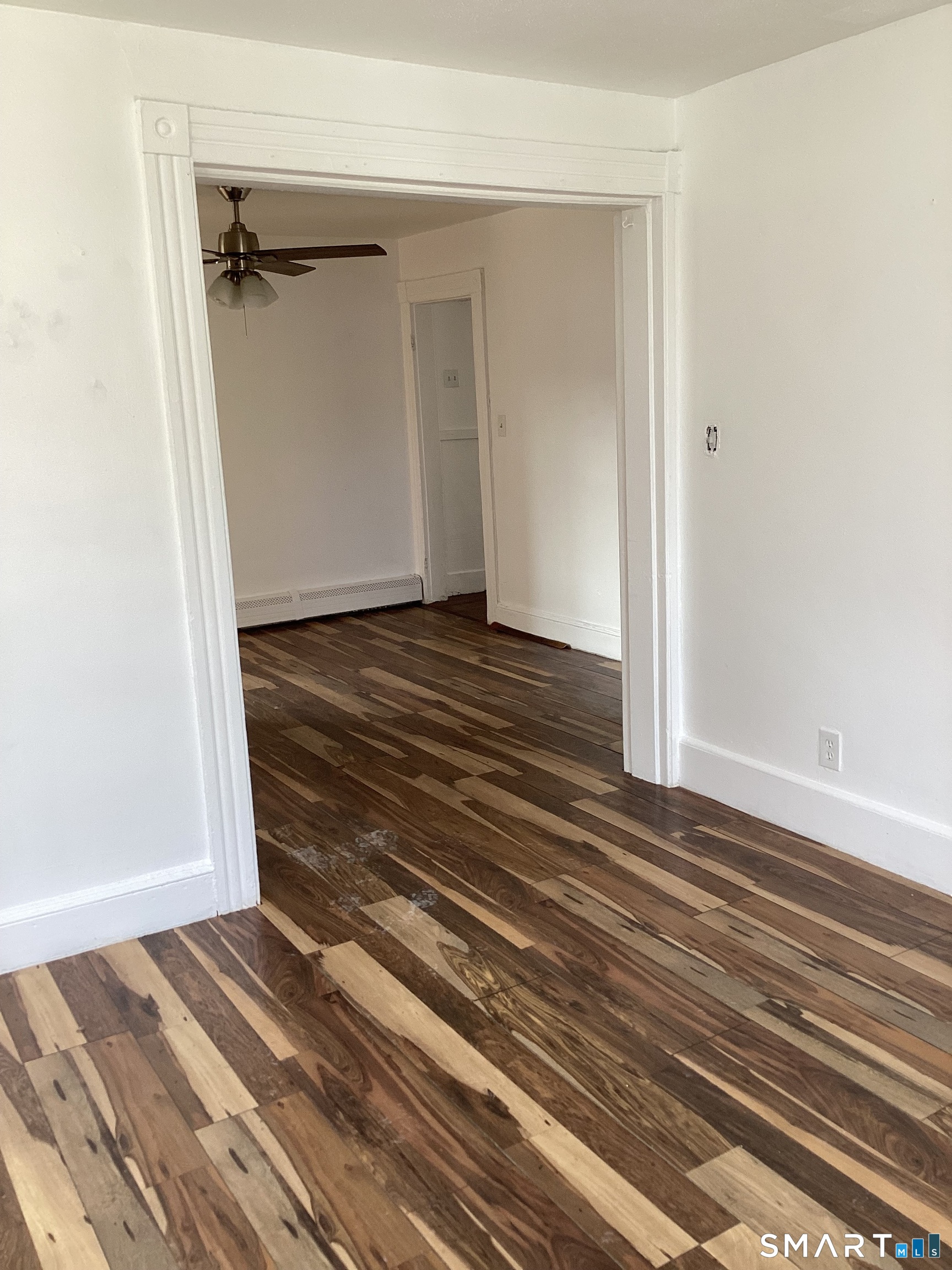 85 Franklin Street Torrington, CT 06790 - Photo 10 of 21 a view of a room with wooden floor and stairs