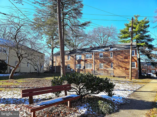 a view of a bench in front of building