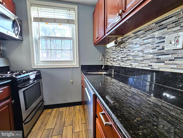 a kitchen with a sink and a stove