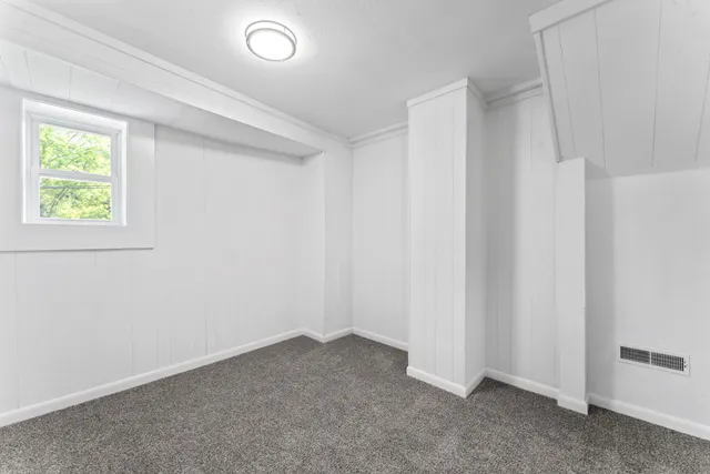 an empty room with closet area