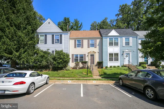 a view of a car parked in front of a house