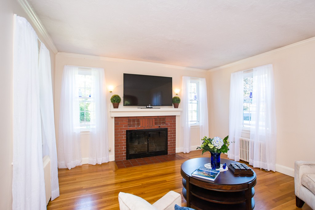 24 Murray Road Newton, MA 02465 - Photo 12 of 30 a living room with furniture and a fireplace