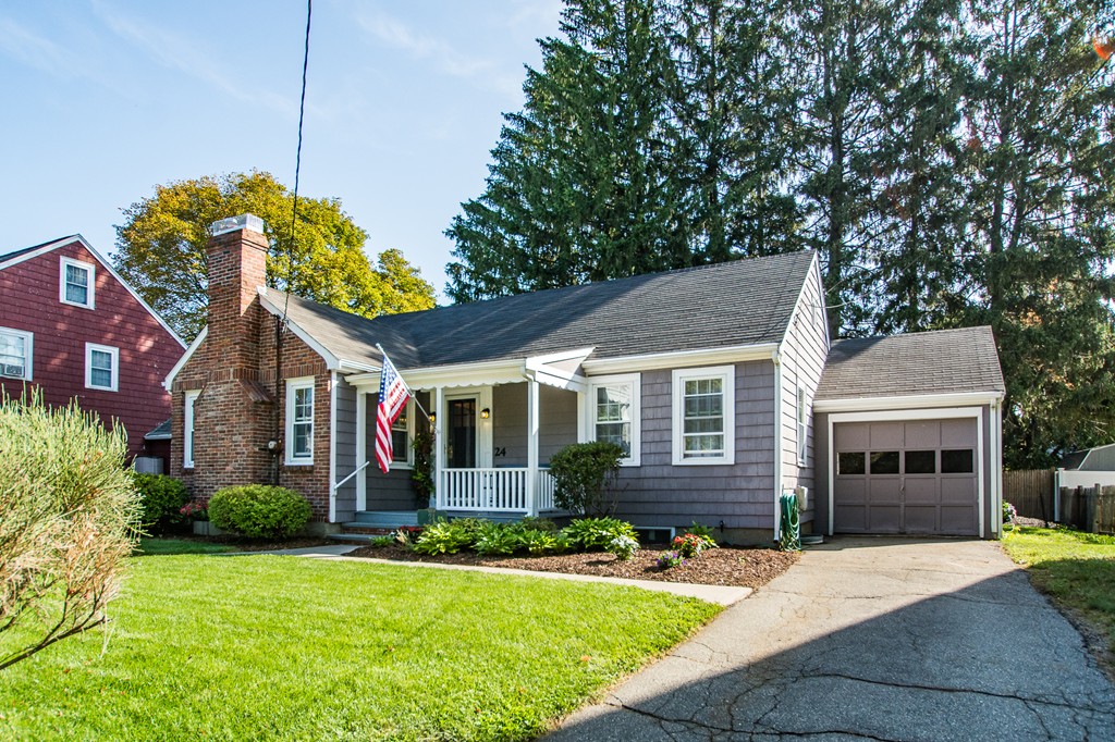 24 Murray Road Newton, MA 02465 - Photo 2 of 30 a front view of a house with a yard and garage