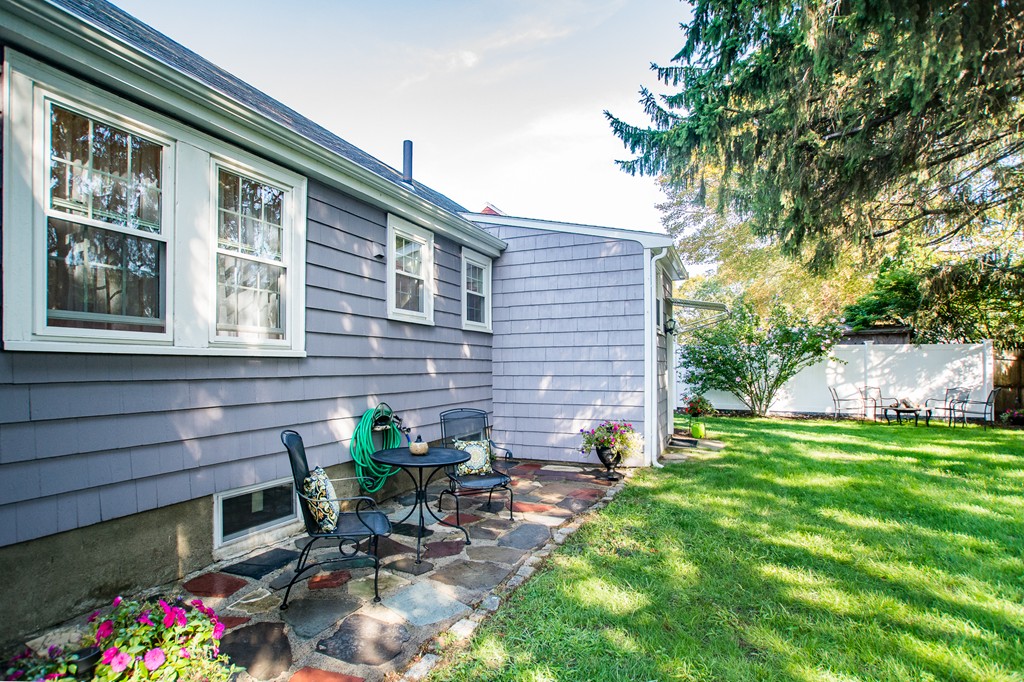 24 Murray Road Newton, MA 02465 - Photo 24 of 30 a backyard of a house with table and chairs
