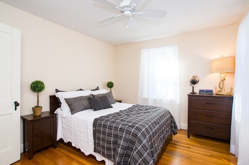 24 Murray Road Newton, MA 02465 - Photo 3 of 30 a bedroom with a bed and a chandelier