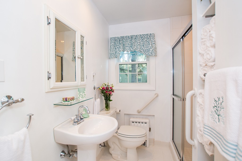24 Murray Road Newton, MA 02465 - Photo 6 of 30 a bathroom with a sink toilet and a mirror