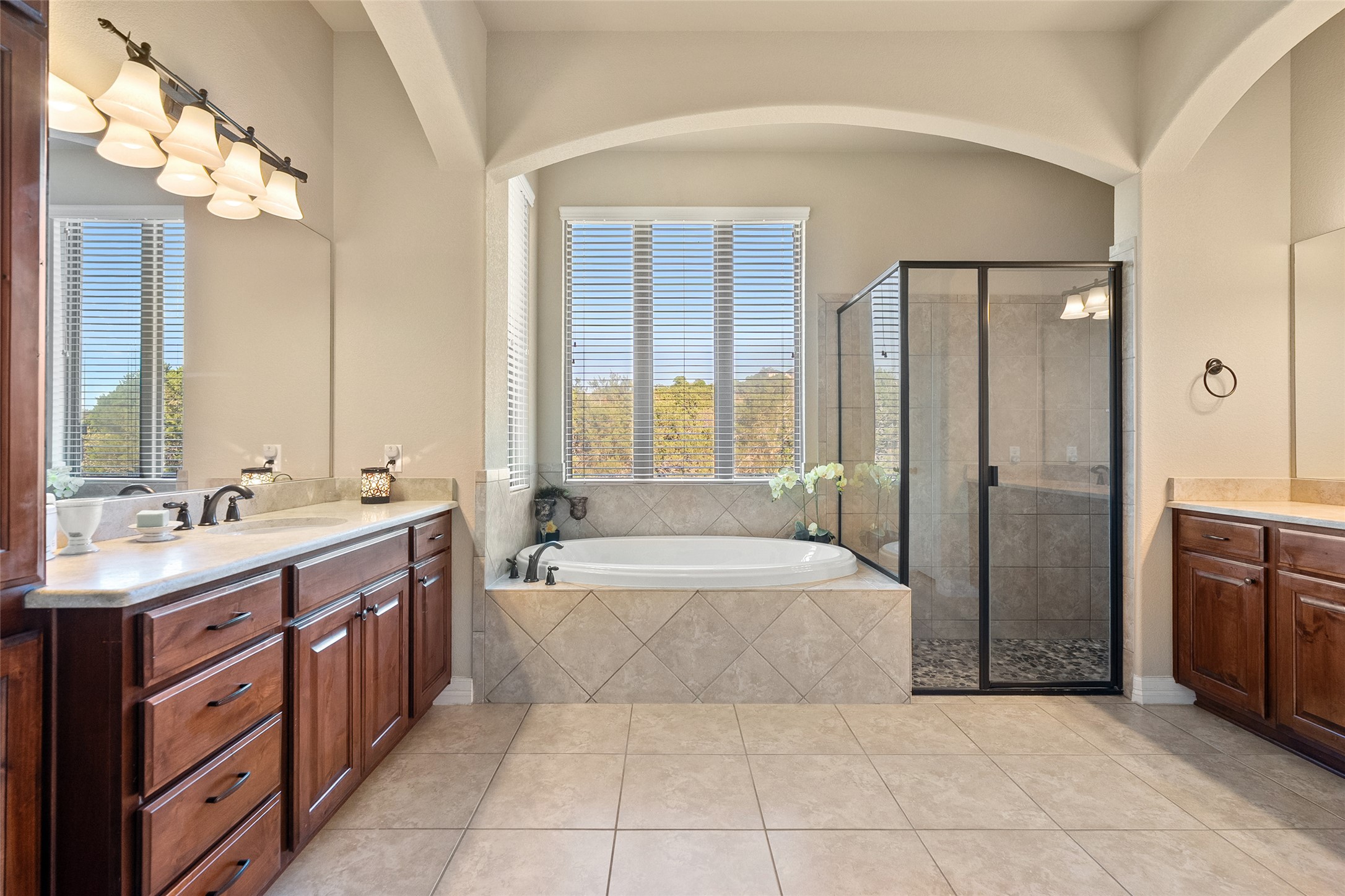 1200 Lions Lair Leander, TX 78641 - Photo 14 of 40 a spacious bathroom with a tub sink shower and mirror