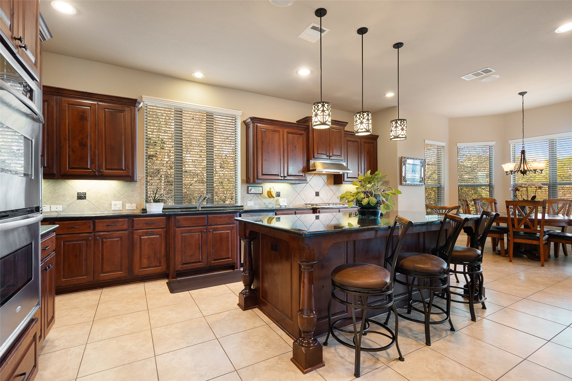 1200 Lions Lair Leander, TX 78641 - Photo 15 of 40 a large kitchen with a table and chairs
