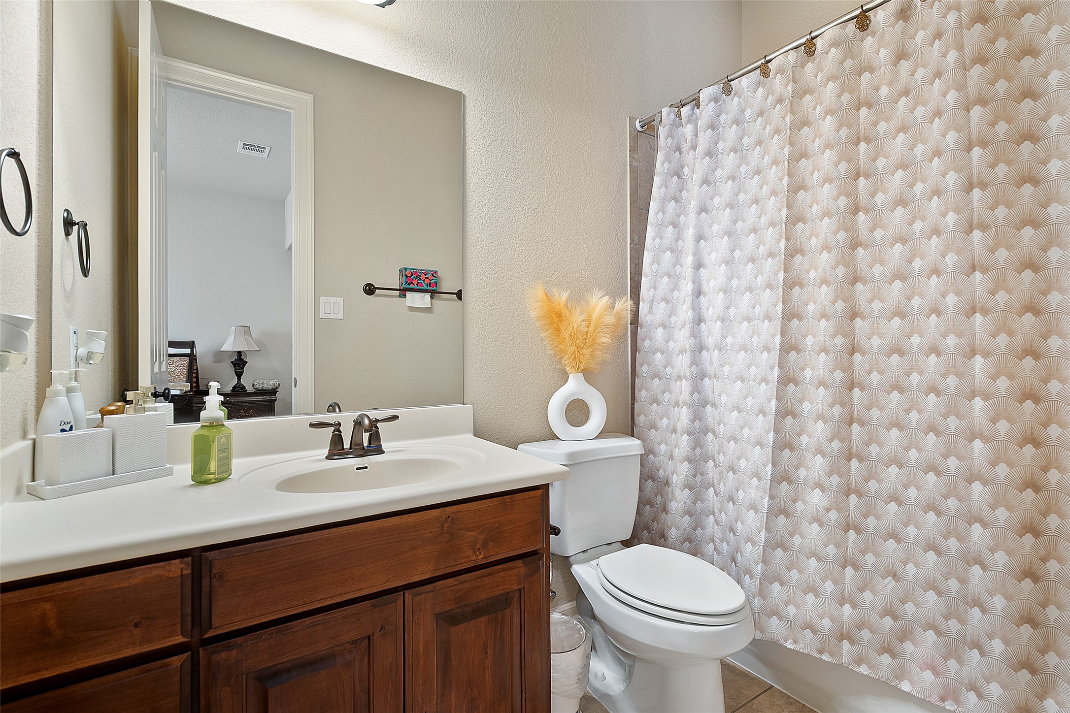 1200 Lions Lair Leander, TX 78641 - Photo 21 of 40 a bathroom with a granite countertop toilet sink and mirror