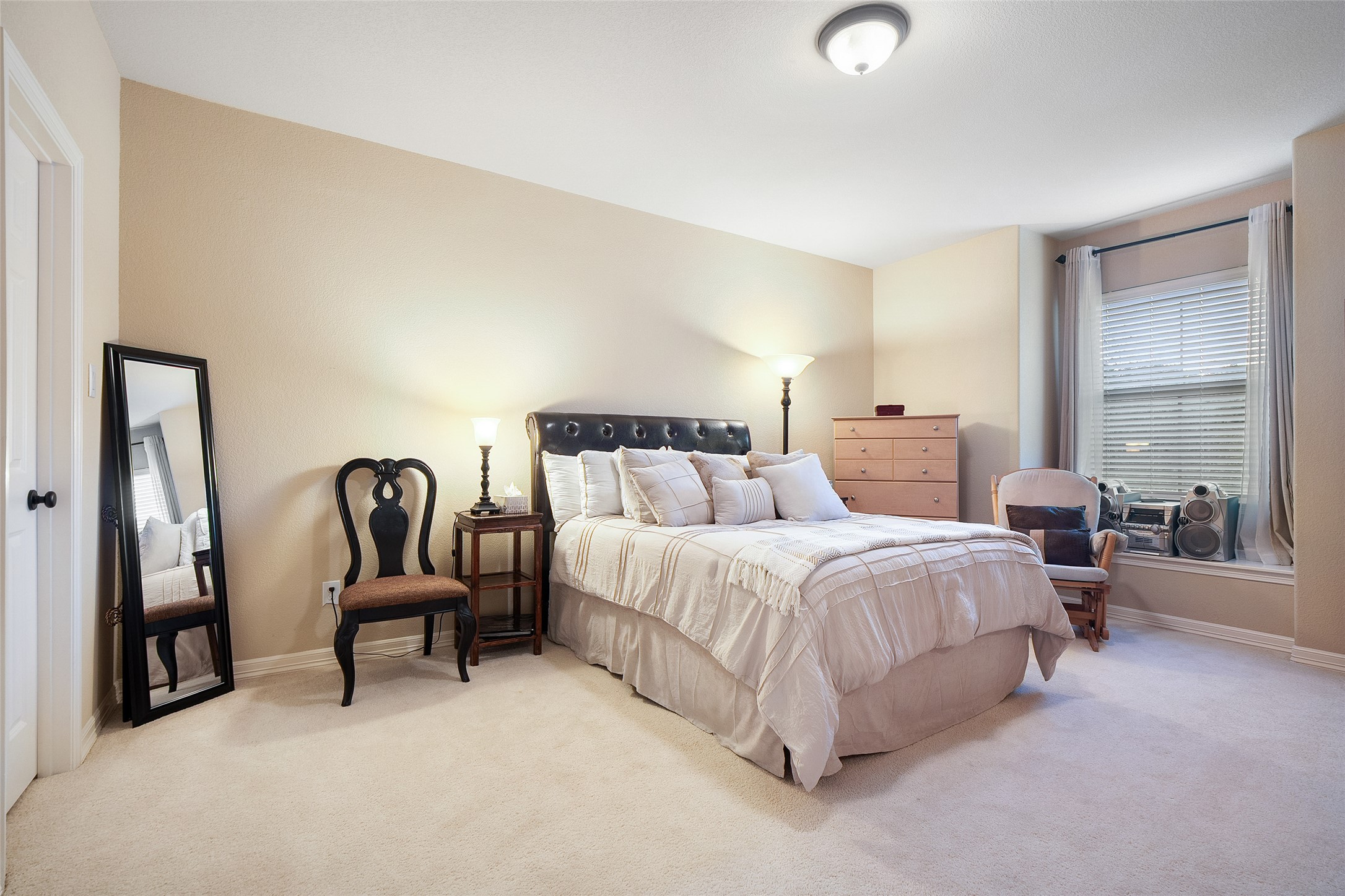 1200 Lions Lair Leander, TX 78641 - Photo 25 of 40 a spacious bedroom with a bed and a cabinets