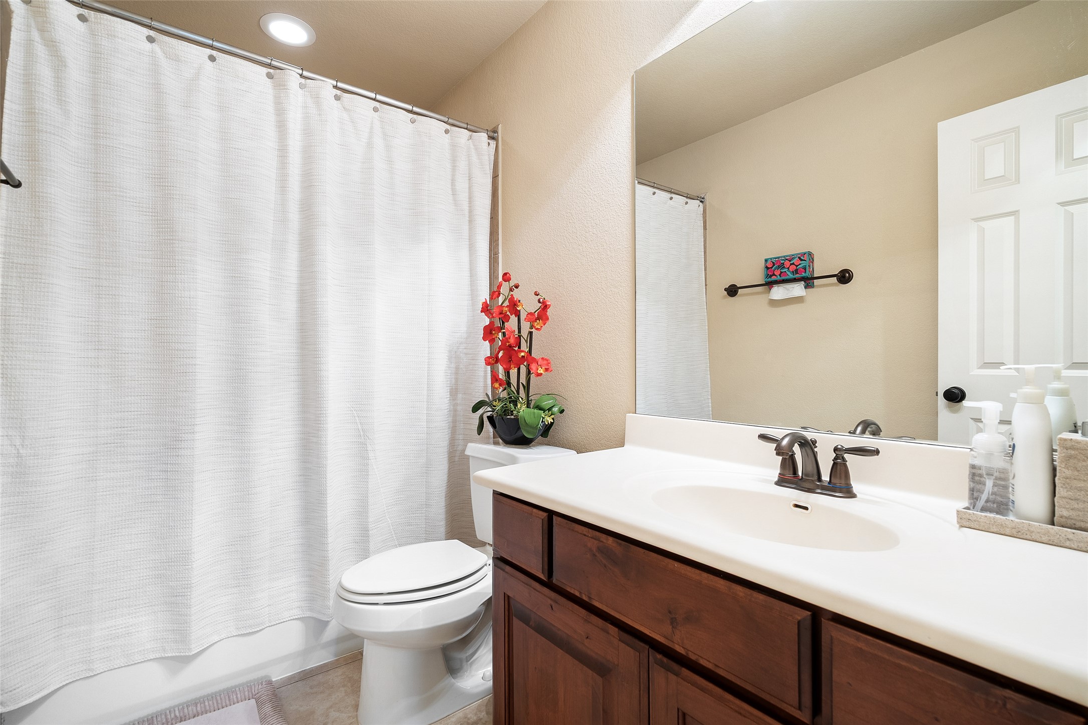 1200 Lions Lair Leander, TX 78641 - Photo 26 of 40 a bathroom with a sink a toilet and a mirror