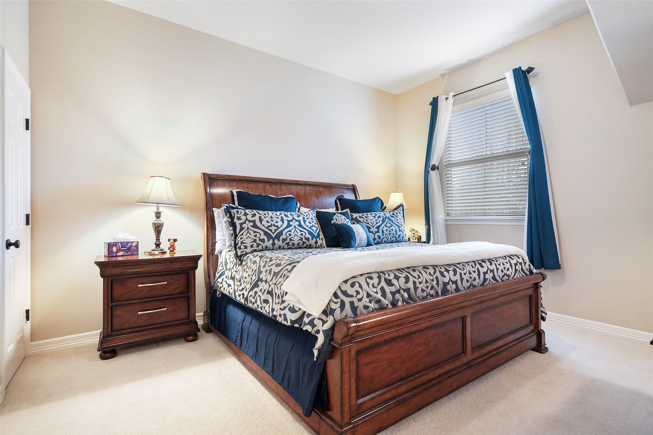1200 Lions Lair Leander, TX 78641 - Photo 29 of 40 a bed sitting in a bedroom next to a window