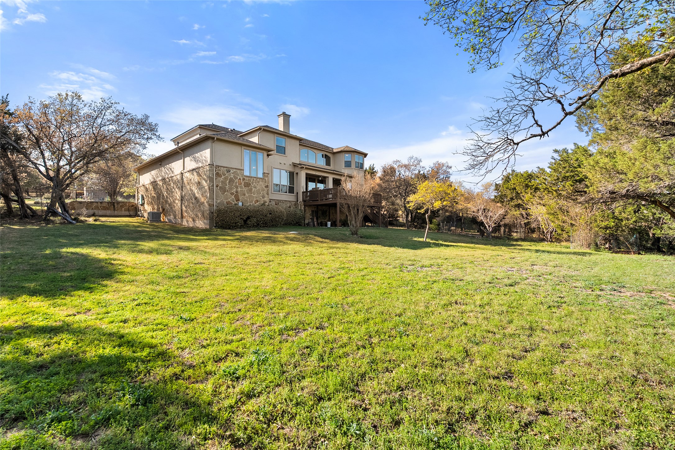 1200 Lions Lair Leander, TX 78641 - Photo 32 of 40 a front view of house with yard and trees in the background