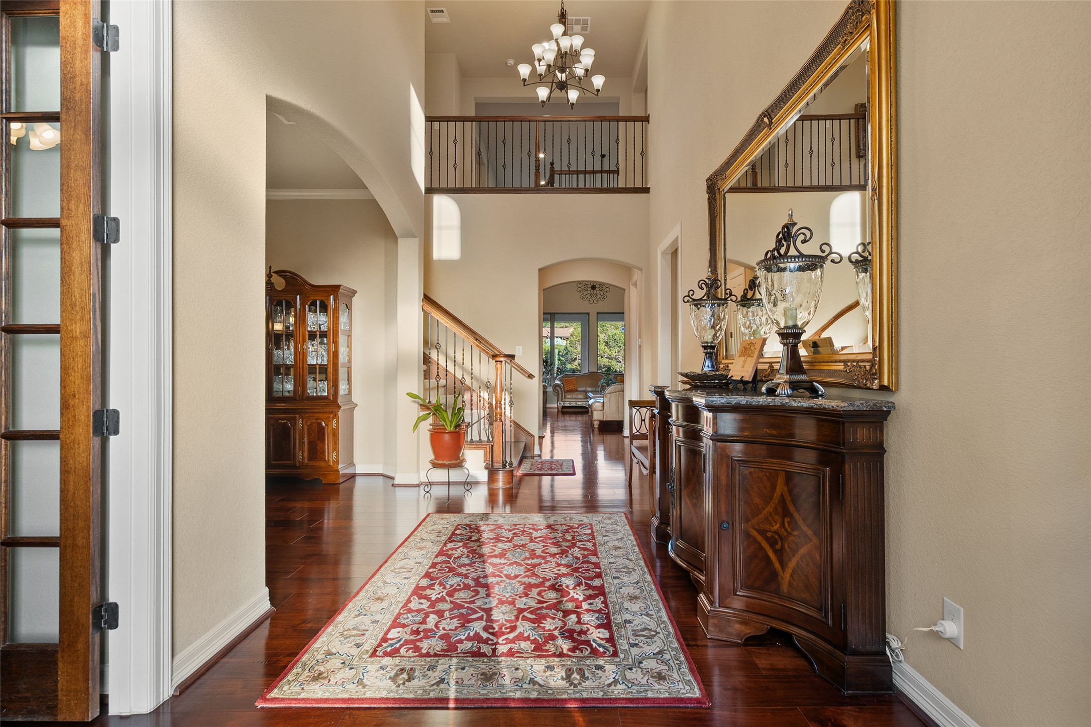 1200 Lions Lair Leander, TX 78641 - Photo 5 of 40 a view of a hallway with furniture and chandelier