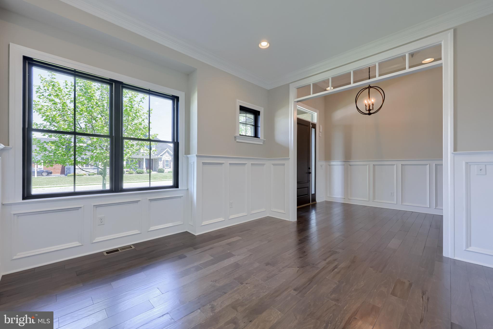 428 Southampton Drive Lititz, PA 17543 - Photo 14 of 60 a view of an empty room with wooden floor and a window
