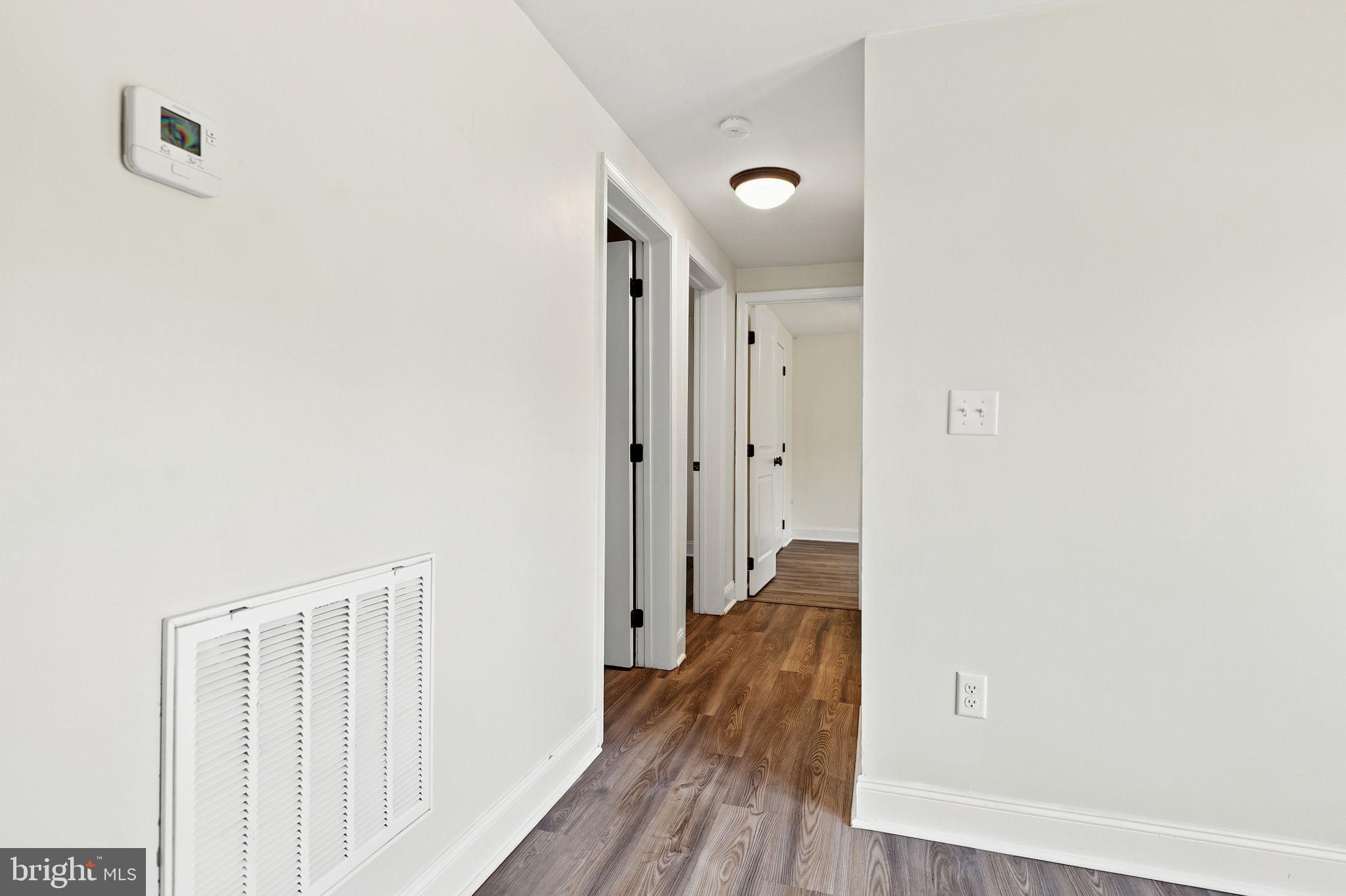 306 Fegan Road Bunker Hill, WV 25413 - Photo 35 of 54 Inviting hallway with modern finishes.