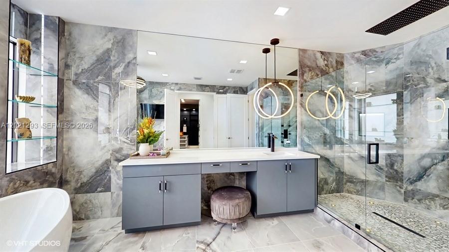 8350 Royal County Down Road Boca Raton, FL 33434 - Photo 22 of 52 a spacious bathroom with a sink double vanity and a mirror