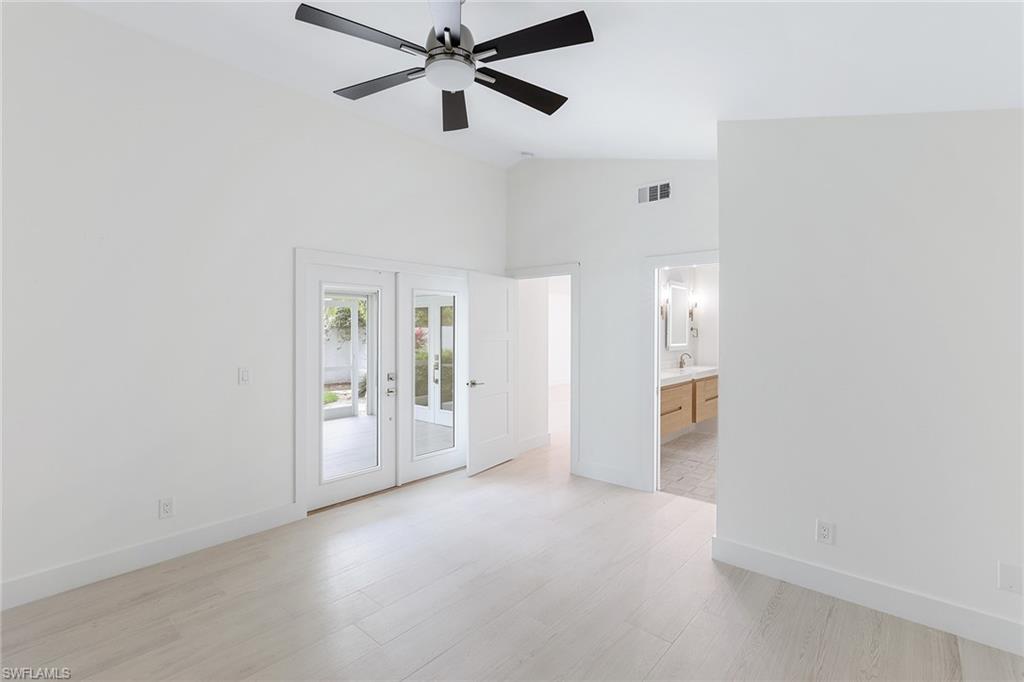 116 Fountain Circle Naples, FL 34119 - Photo 11 of 24 a view of a livingroom with a ceiling fan and window
