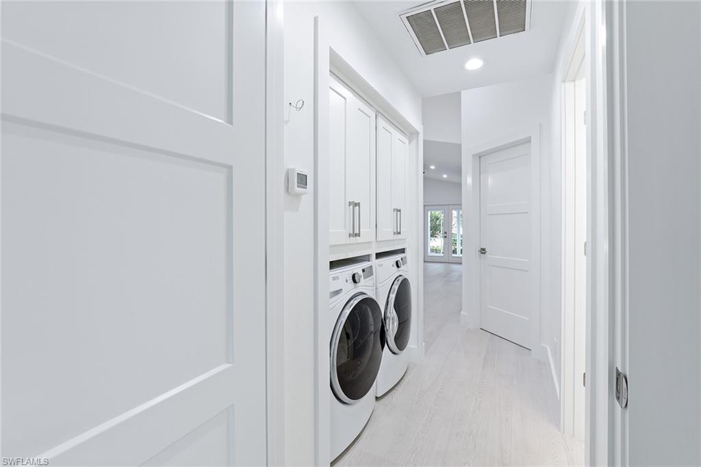 116 Fountain Circle Naples, FL 34119 - Photo 17 of 24 a utility room with dryer and washer