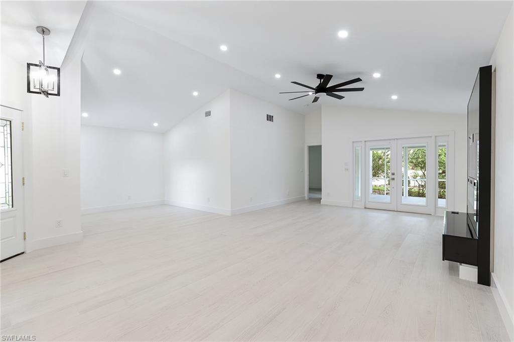 116 Fountain Circle Naples, FL 34119 - Photo 19 of 24 an empty room with fan and windows