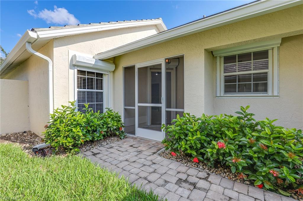 116 Fountain Circle Naples, FL 34119 - Photo 3 of 24 front view of a house