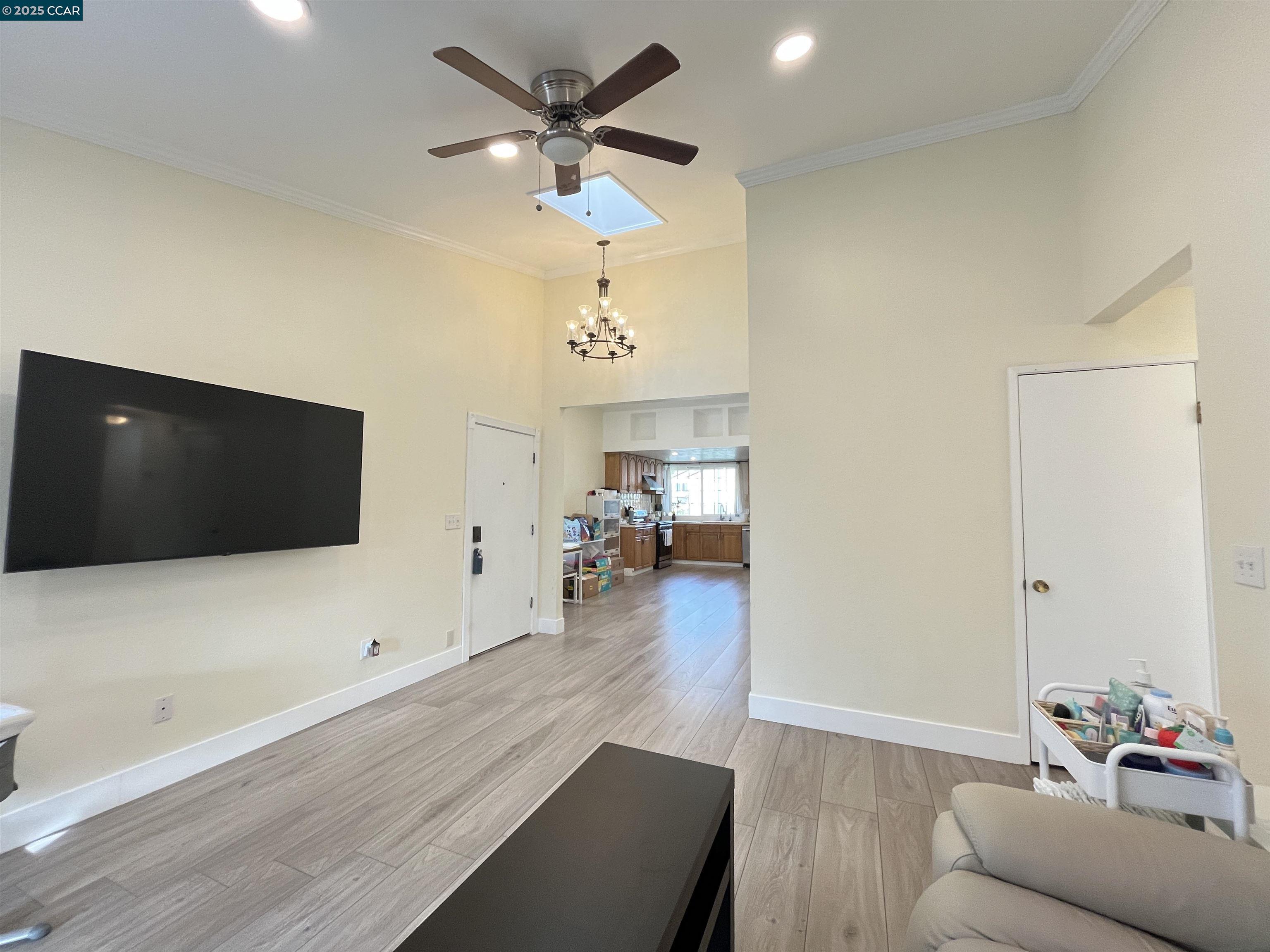 120 Bonita Court Rodeo, CA 94572 - Photo 19 of 49 a living room with furniture and a flat screen tv