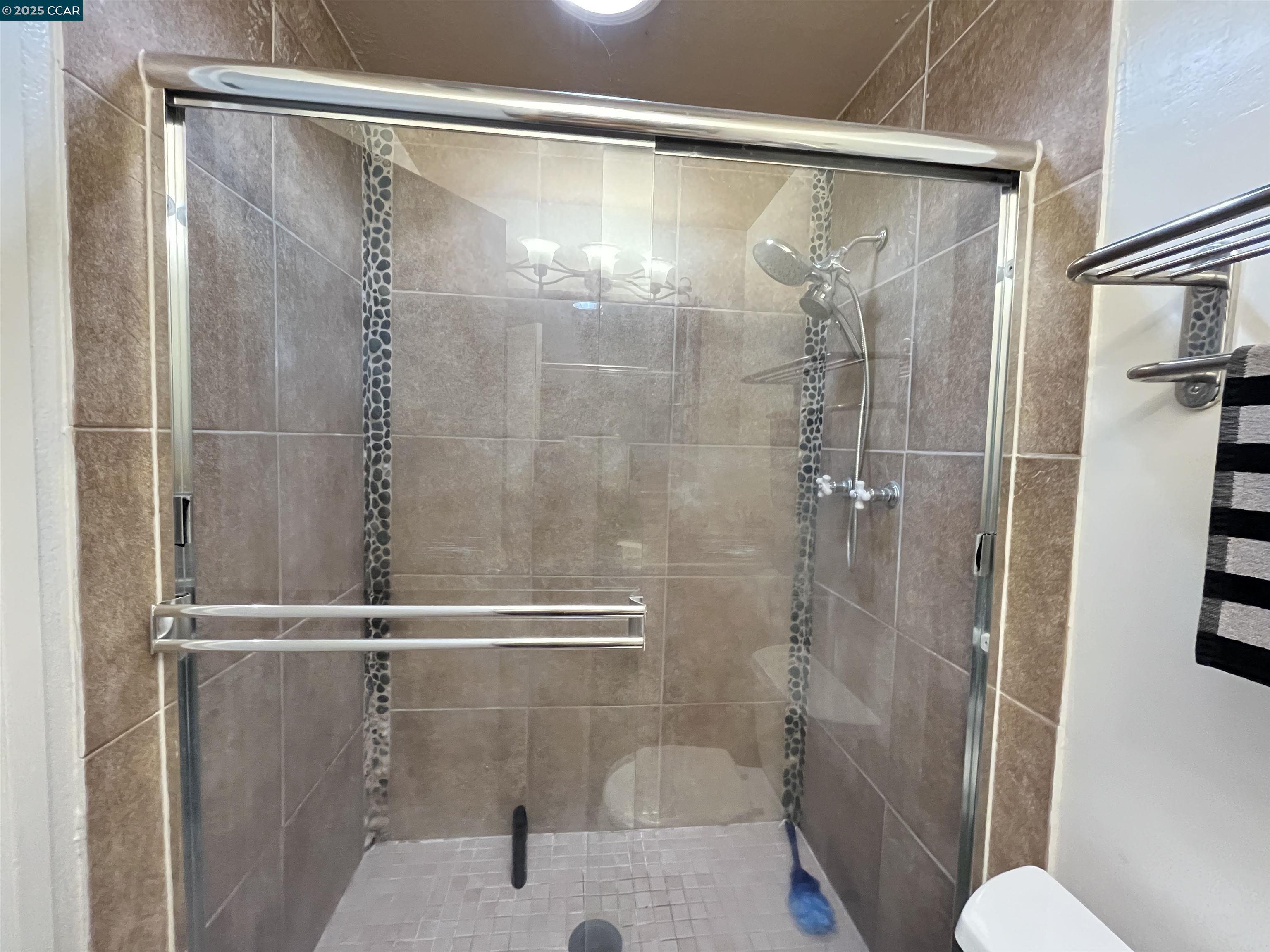120 Bonita Court Rodeo, CA 94572 - Photo 26 of 49 a bathroom with a shower and toilet