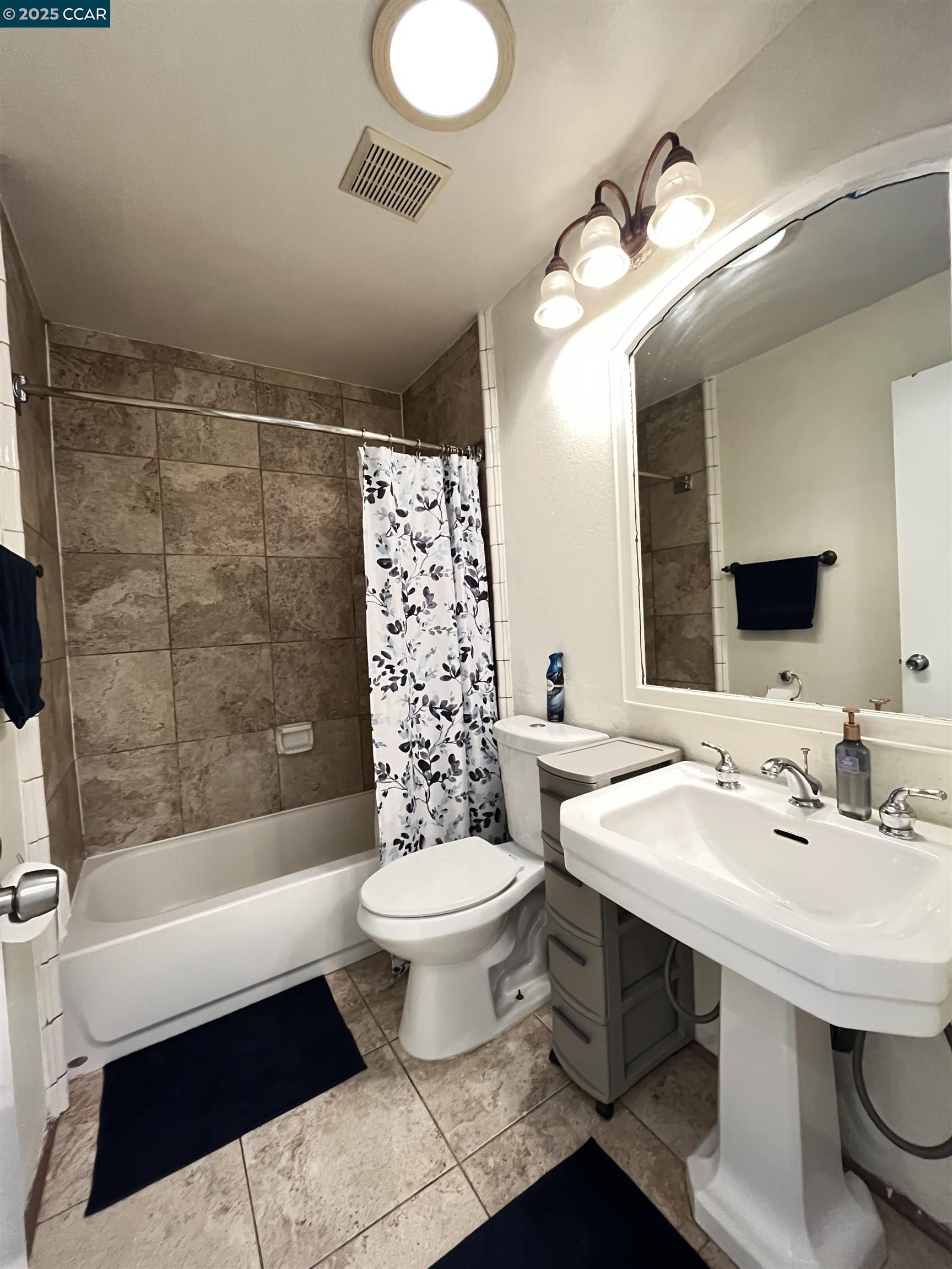 120 Bonita Court Rodeo, CA 94572 - Photo 32 of 49 a bathroom with a sink toilet a mirror and shower