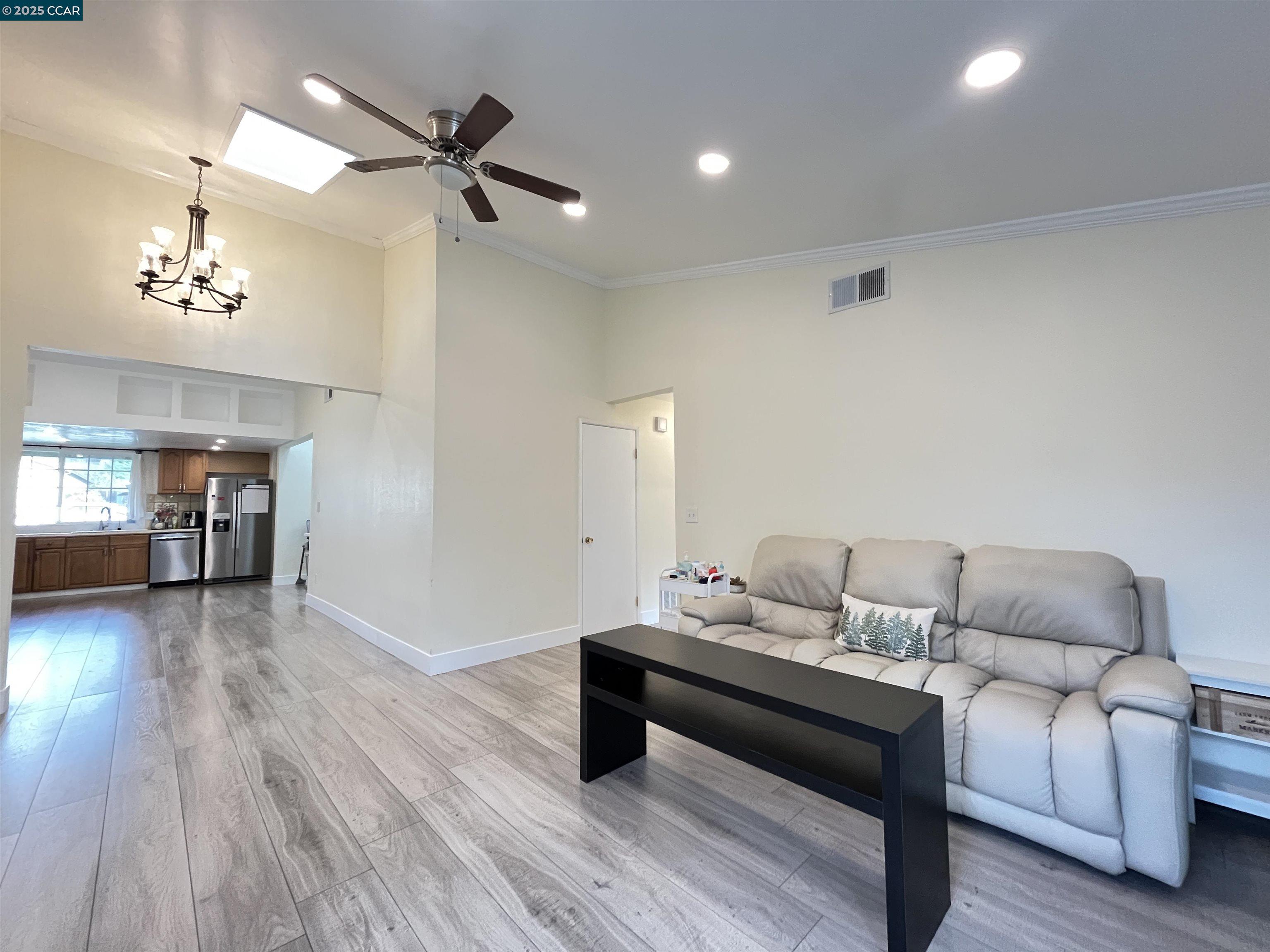 120 Bonita Court Rodeo, CA 94572 - Photo 6 of 49 a living room with furniture and a wooden floor