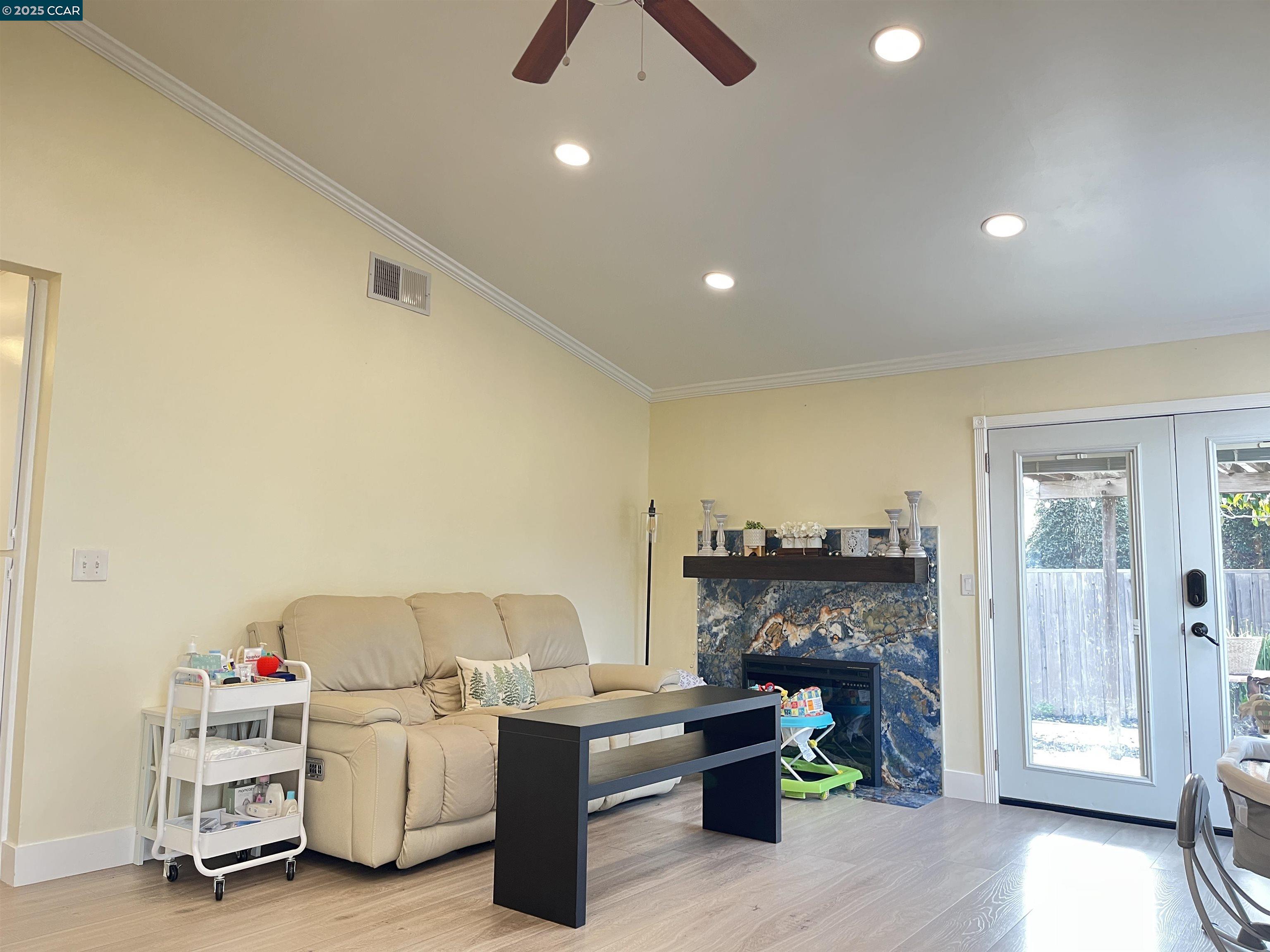 120 Bonita Court Rodeo, CA 94572 - Photo 8 of 49 a living room with furniture and a fireplace