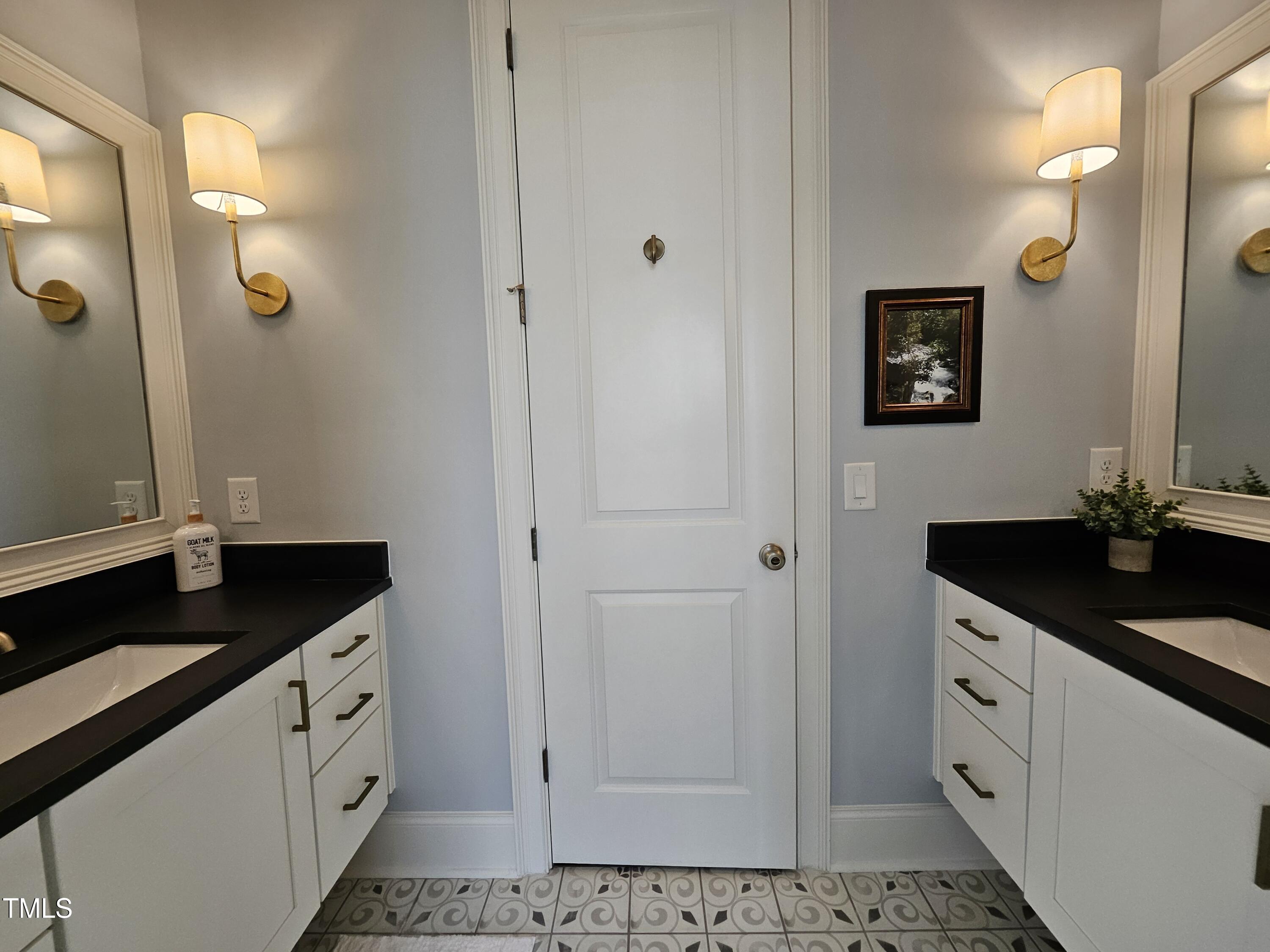 1317 Pecora Lane Raleigh, NC 27607 - Photo 27 of 48 Upstairs bath with dual vanities and a separate water closet with bathtub