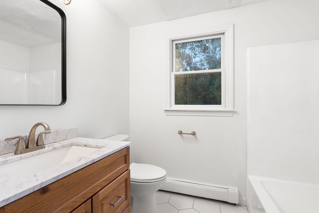 34 Saddleback Road Mashpee, MA 02649 - Photo 13 of 24 a bathroom with a sink toilet and a mirror