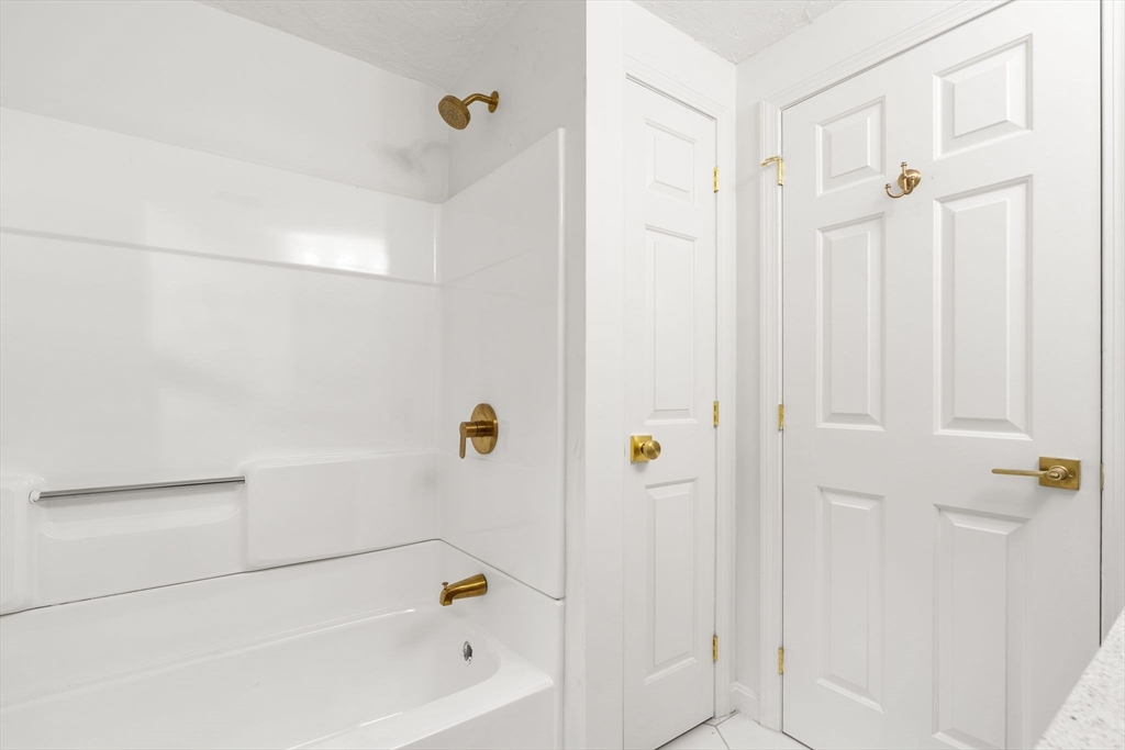 34 Saddleback Road Mashpee, MA 02649 - Photo 18 of 24 a bathroom with a bathtub