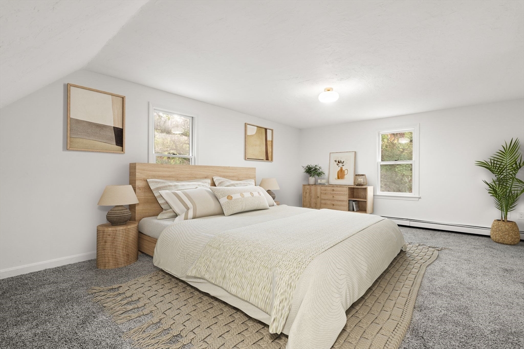 34 Saddleback Road Mashpee, MA 02649 - Photo 19 of 24 a bedroom with a large bed and potted plant with two window