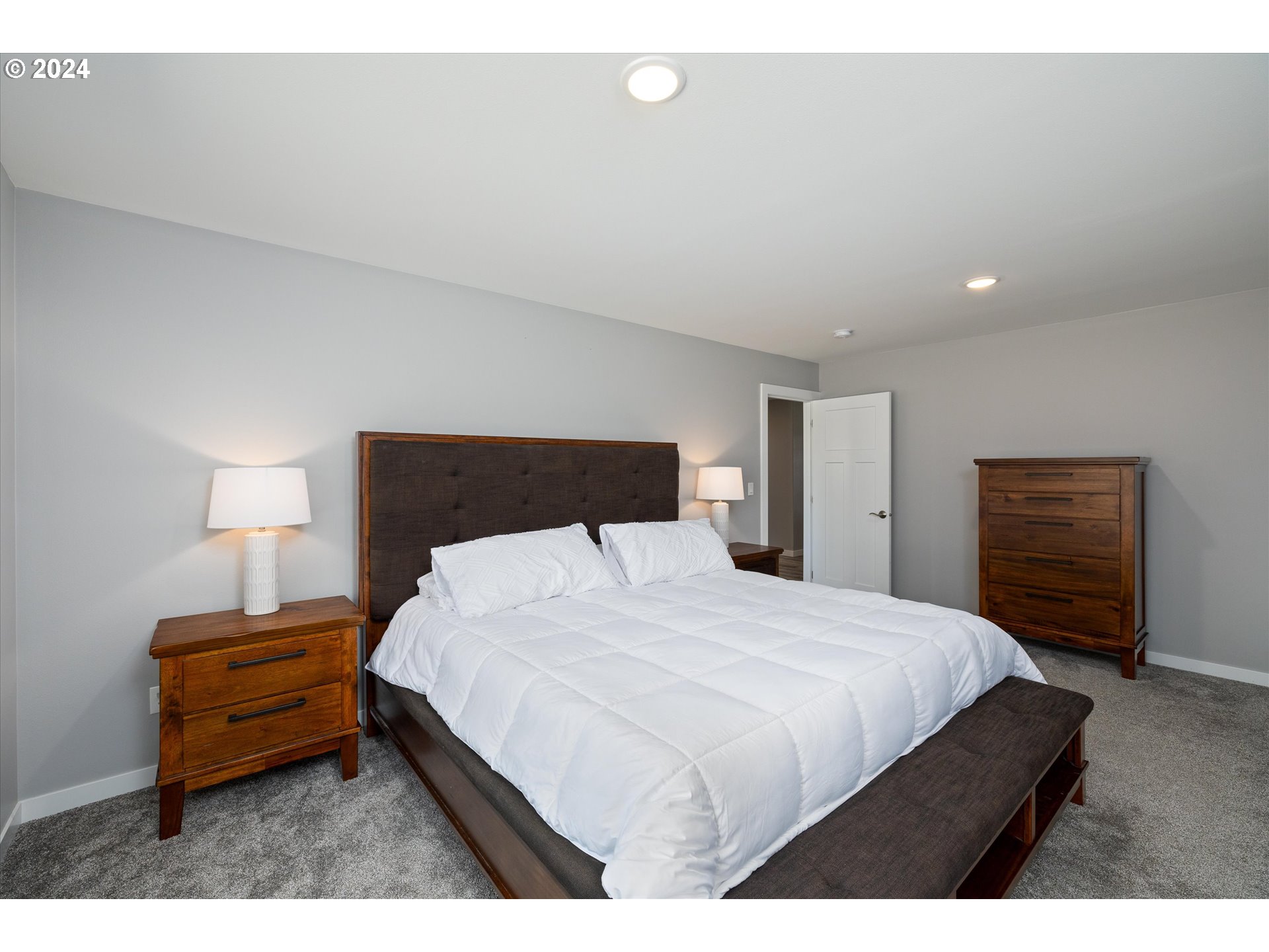 1489 Elberta Street West The Dalles, OR 97058 - Photo 12 of 29 a bedroom with a bed and a television