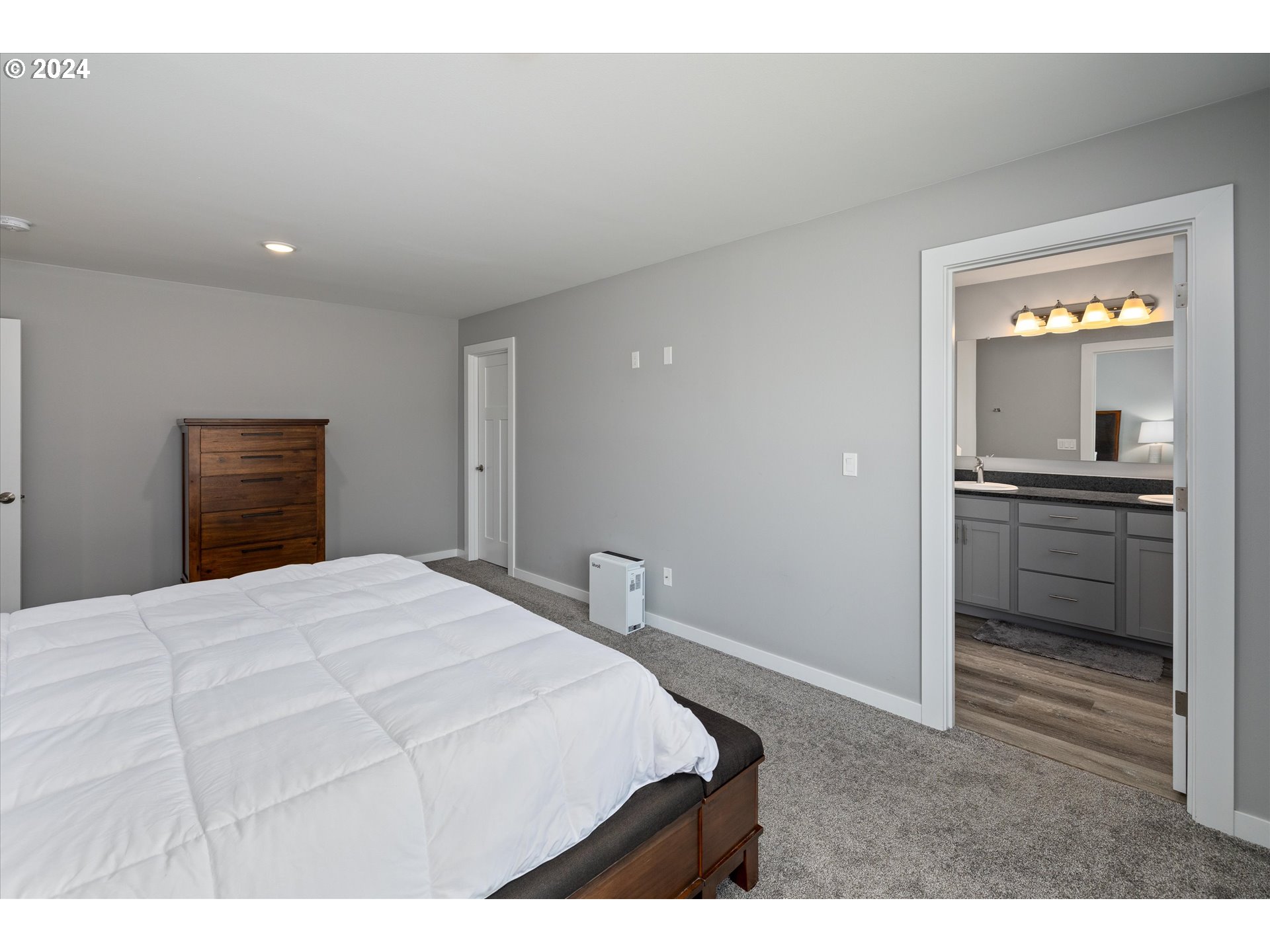 1489 Elberta Street West The Dalles, OR 97058 - Photo 14 of 29 a bedroom with a bed and a view of kitchen