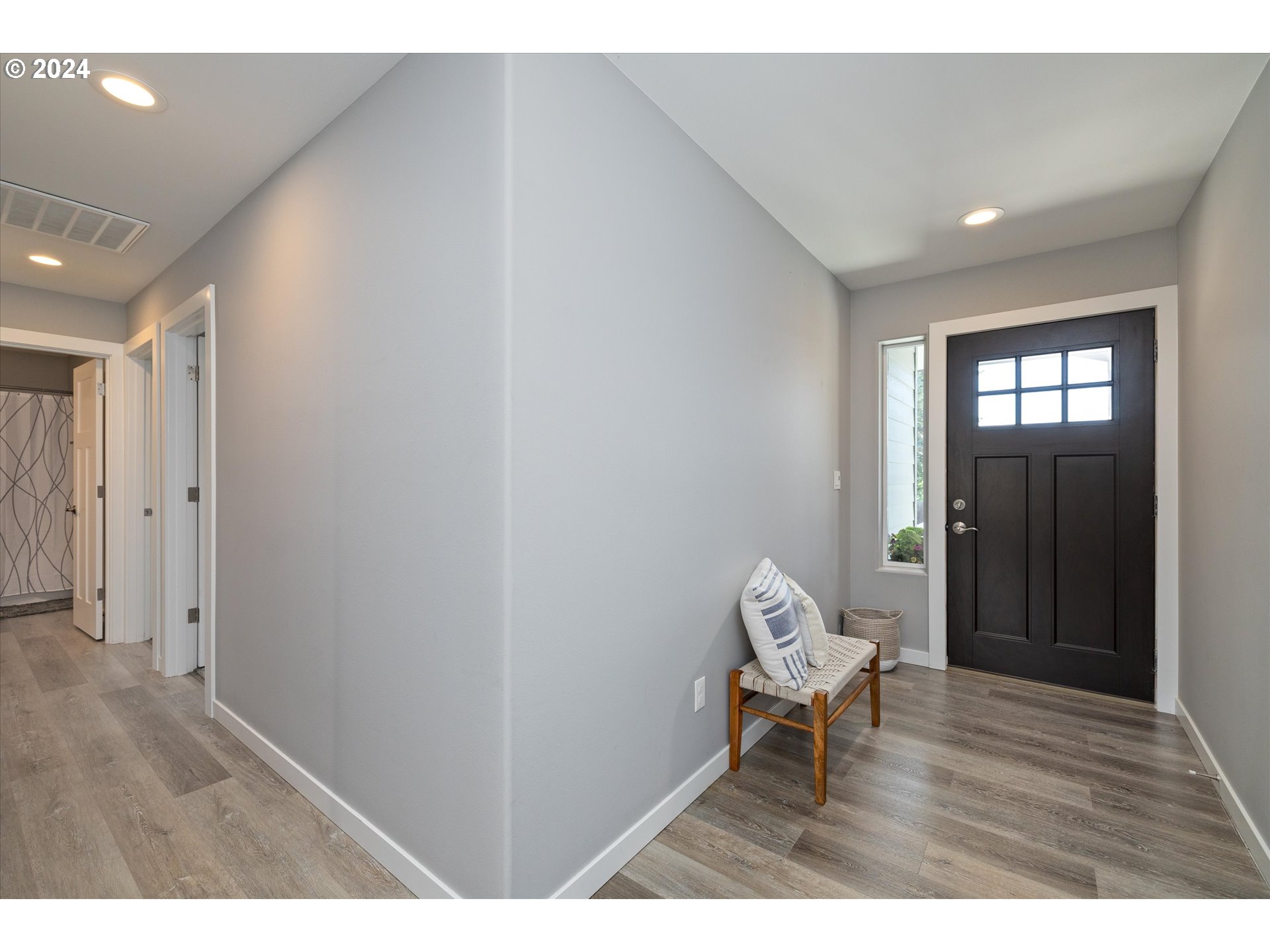 1489 Elberta Street West The Dalles, OR 97058 - Photo 17 of 29 a room with a chair and wooden floor
