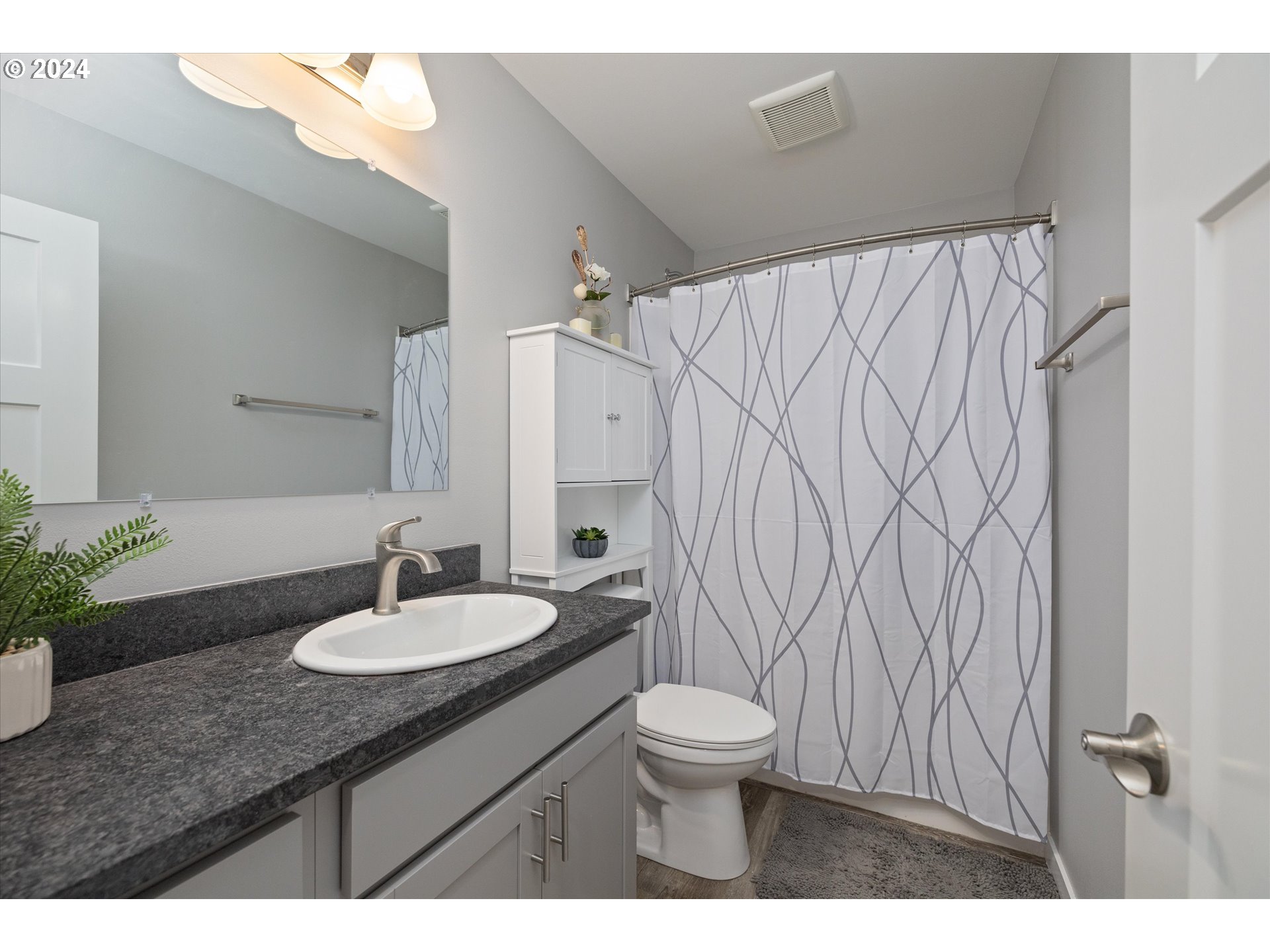 1489 Elberta Street West The Dalles, OR 97058 - Photo 20 of 29 a bathroom with a sink toilet and shower