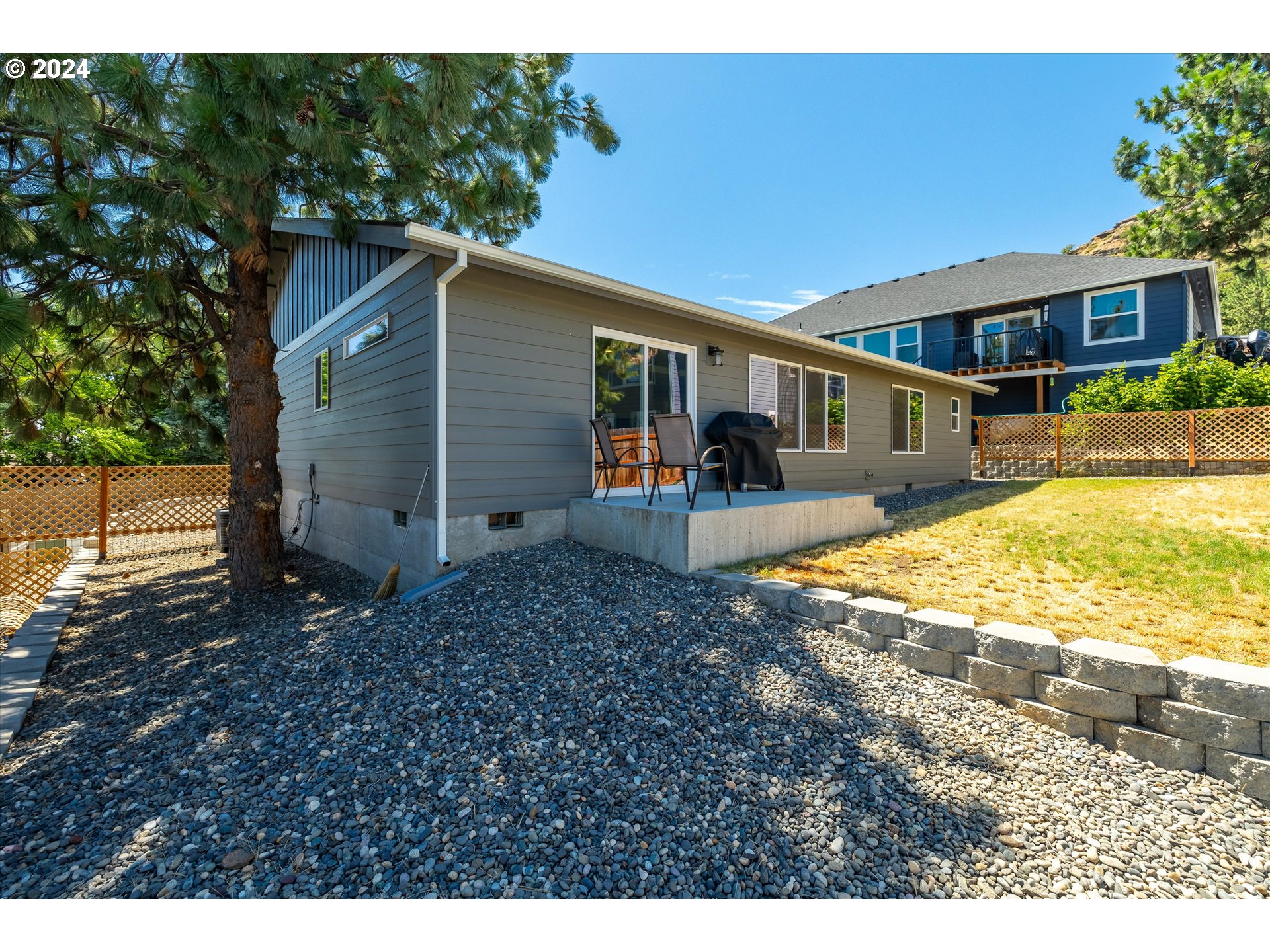 1489 Elberta Street West The Dalles, OR 97058 - Photo 25 of 29 a view of a house with backyard and sitting area