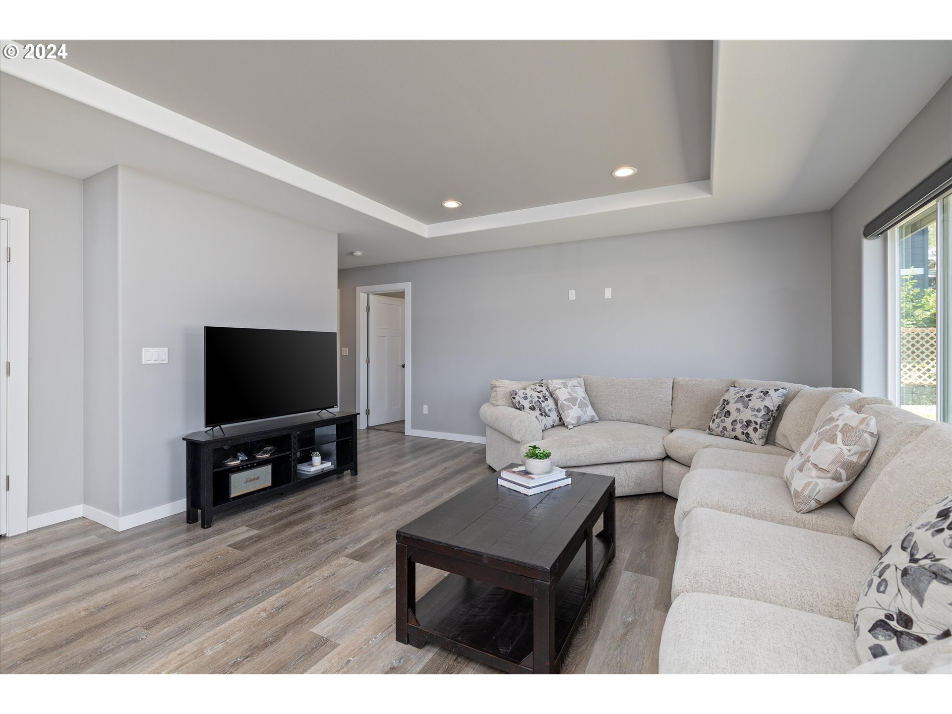 1489 Elberta Street West The Dalles, OR 97058 - Photo 5 of 29 a living room with furniture and a flat screen tv