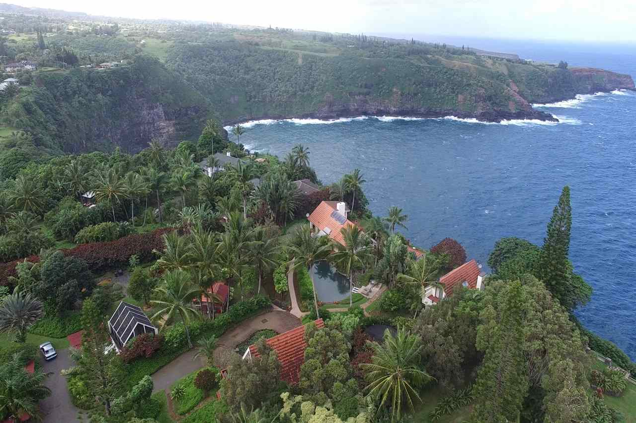 an aerial view of house with yard