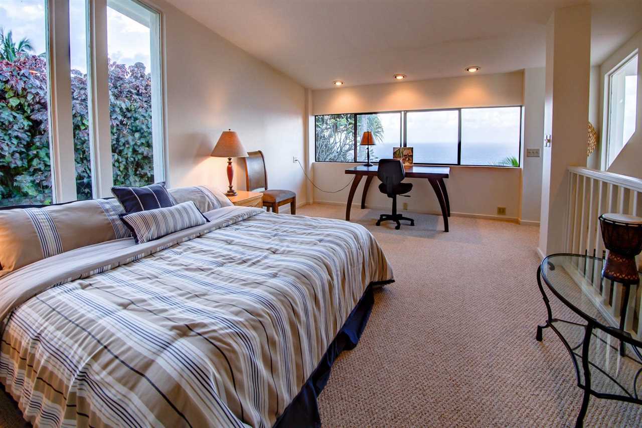 311 Door Of Faith Road Haiku, HI 96708 - Photo 17 of 30 a bed room with two bed and a large window