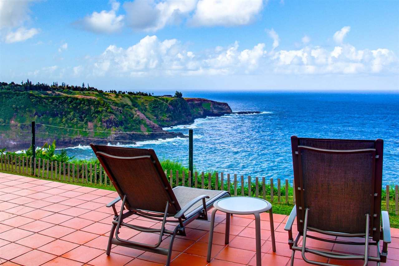 311 Door Of Faith Road Haiku, HI 96708 - Photo 18 of 30 a view of a chairs and table in the patio