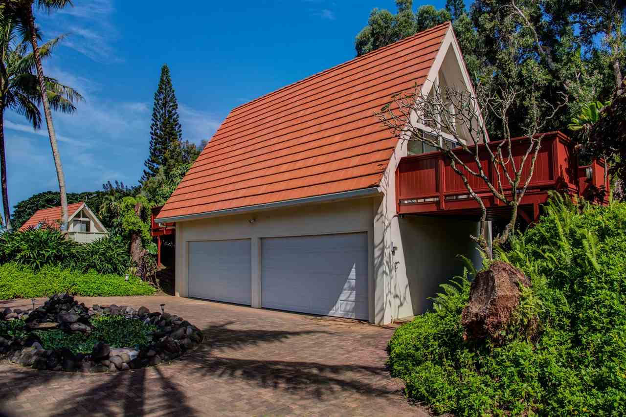 311 Door Of Faith Road Haiku, HI 96708 - Photo 28 of 30 a front view of a house with a garden