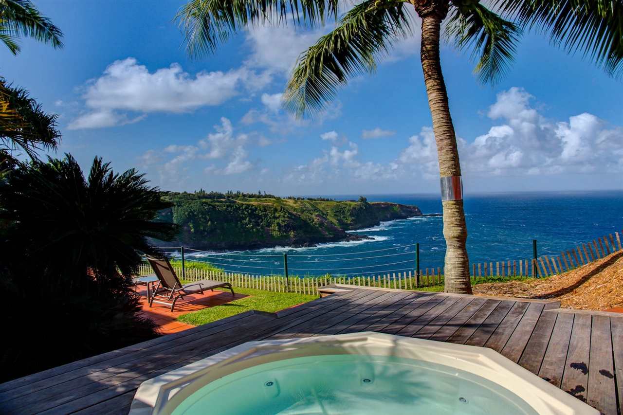 311 Door Of Faith Road Haiku, HI 96708 - Photo 5 of 30 a view of swimming pool with a table and chairs