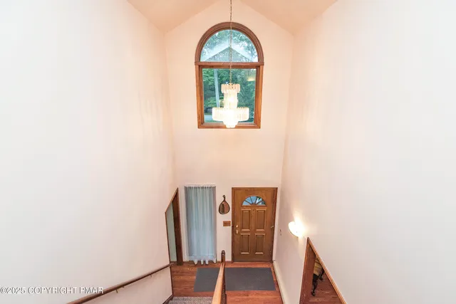 a kitchen with stainless steel appliances granite countertop a refrigerator stove microwave and sink