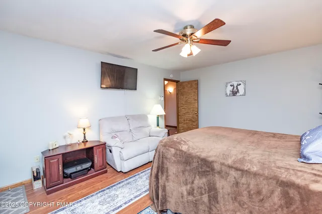 a kitchen with stainless steel appliances granite countertop a stove a sink dishwasher and cabinets with wooden floor