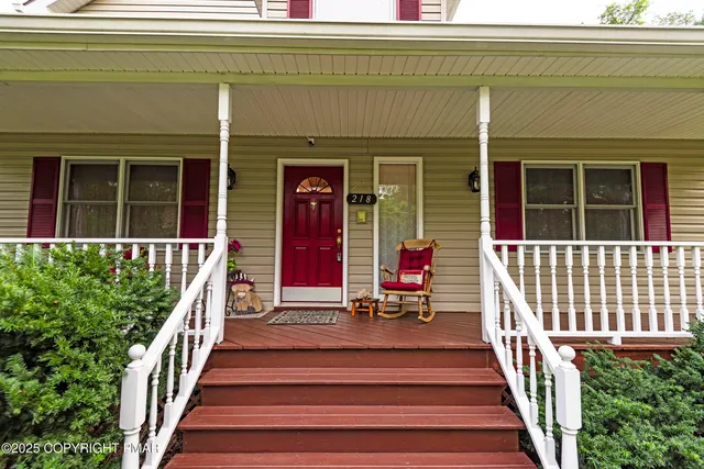 a house with swimming pool in front of it